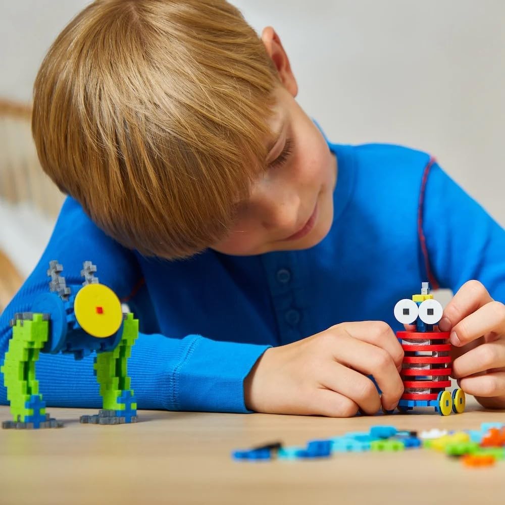 A colorful Plus-Plus robot-building set for children aged 5–12, featuring 275 interlocking pieces in vibrant shades. Encourages creativity, fine motor skills, and STEAM learning.