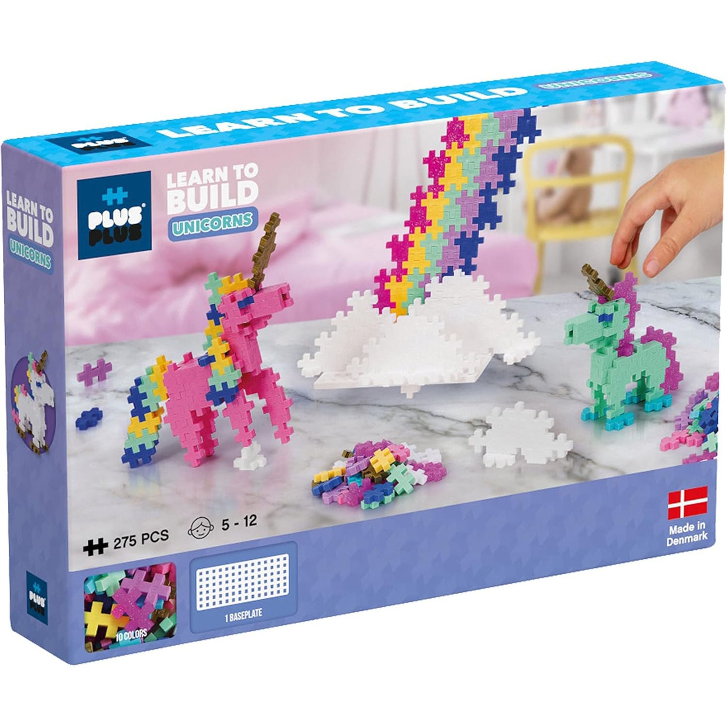 "The front of the Plus-Plus Learn to Build Unicorns box, featuring colorful unicorn illustrations and branding, highlighting the 275-piece creative building set.