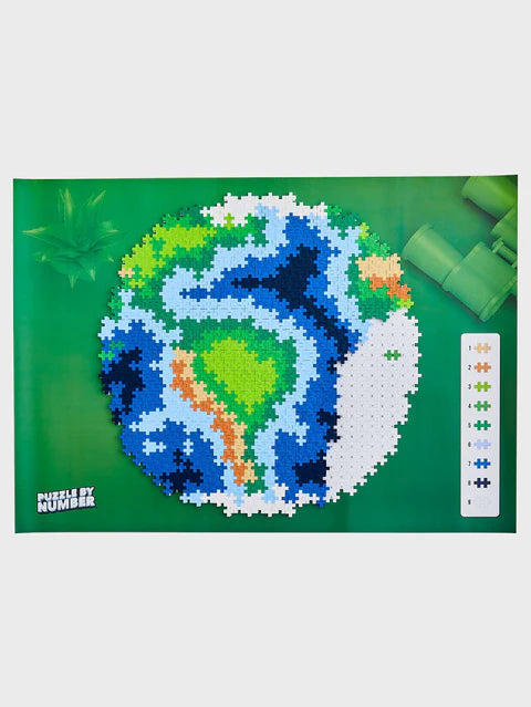 "A partially completed Plus-Plus Puzzle By Number Earth, with a visible colour-matching key, demonstrating the simple step-by-step building process.