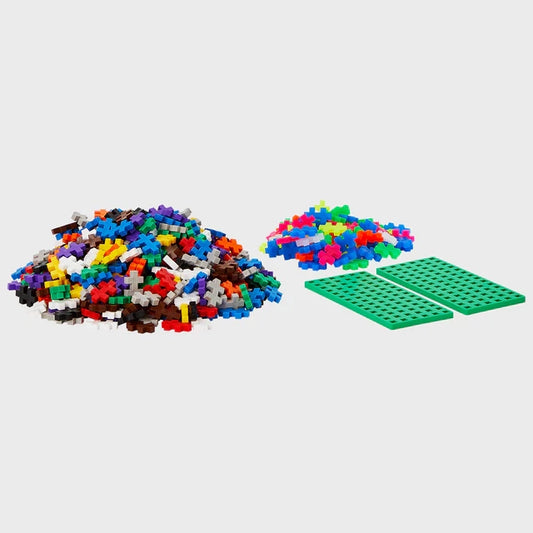 Contents of Plus-Plus Metal Suitcase containing 600 colourful interlocking pieces, designed for creative building on the go.