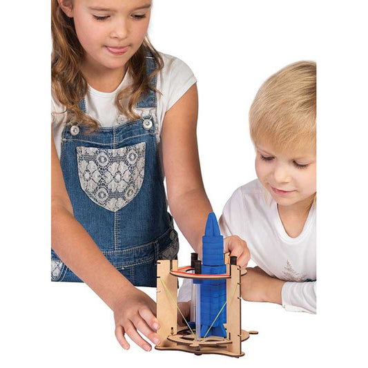 Two children excitedly playing with the Smartivity Rocket Launcher, assembling the wooden launch pad and preparing to launch the coloruful rocket, engaging in hands-on STEM learning.