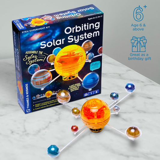 Thames & Kosmos Orbiting Solar System kit with box and motorized model displayed in front. A hands-on STEM set exploring planetary motion and space science.