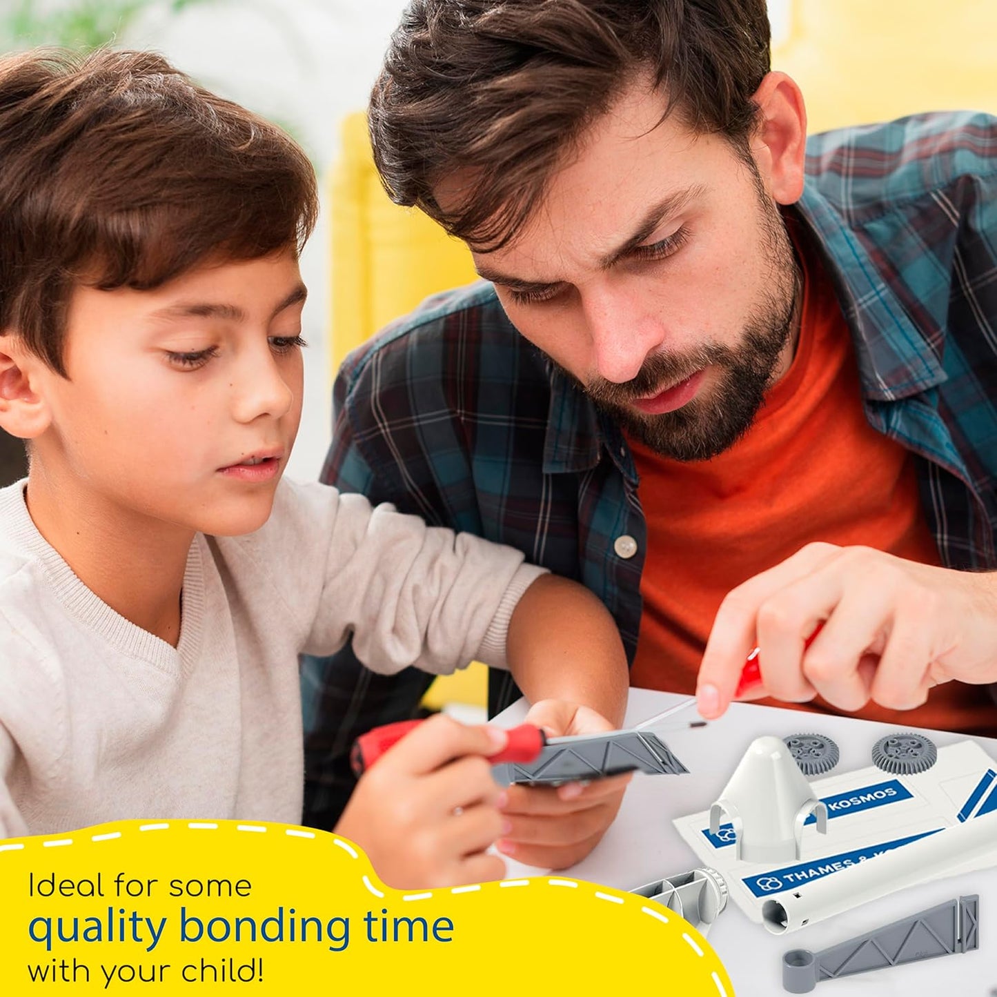 Dad and son building the Thames & Kosmos Wind Power kit. A hands-on STEM set for exploring renewable energy—ideal for quality bonding time with your child.