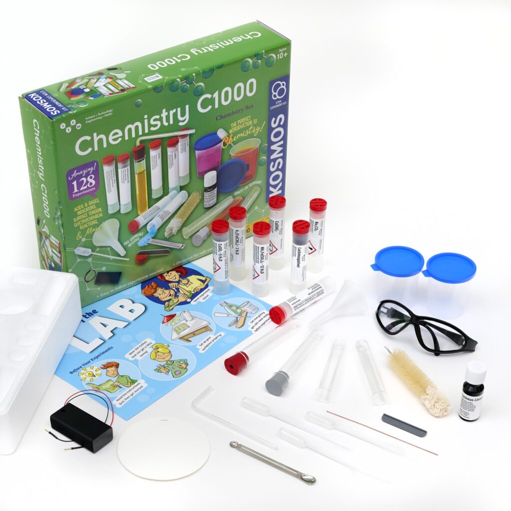 Thames & Kosmos Chemistry C1000 Set with box and contents displayed. Includes lab equipment, chemicals, and a full-color experiment manual for hands-on STEM learning.