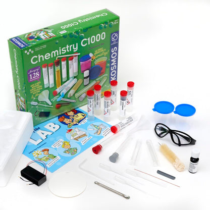 Thames & Kosmos Chemistry C1000 Set with box and contents displayed. Includes lab equipment, chemicals, and a full-color experiment manual for hands-on STEM learning.