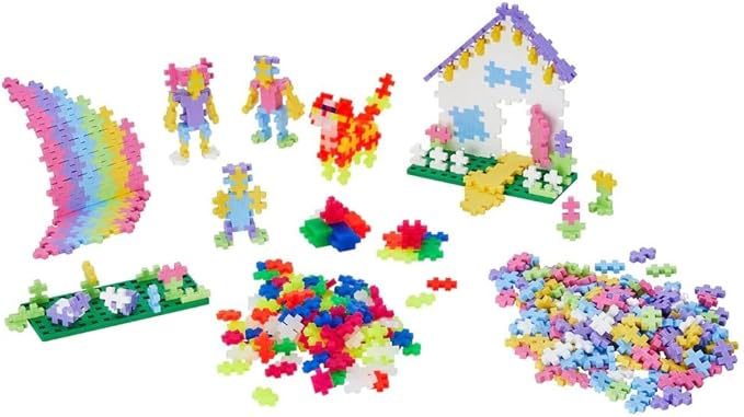 Several colourful Plus-Plus models built from interlocking pieces, with a small pile of loose pieces nearby - hours of fun!
