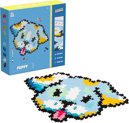 The Plus-Plus Puzzle By Number Puppy box alongside a completed puppy model built from 500 colorful interlocking pieces, showcasing the final design.