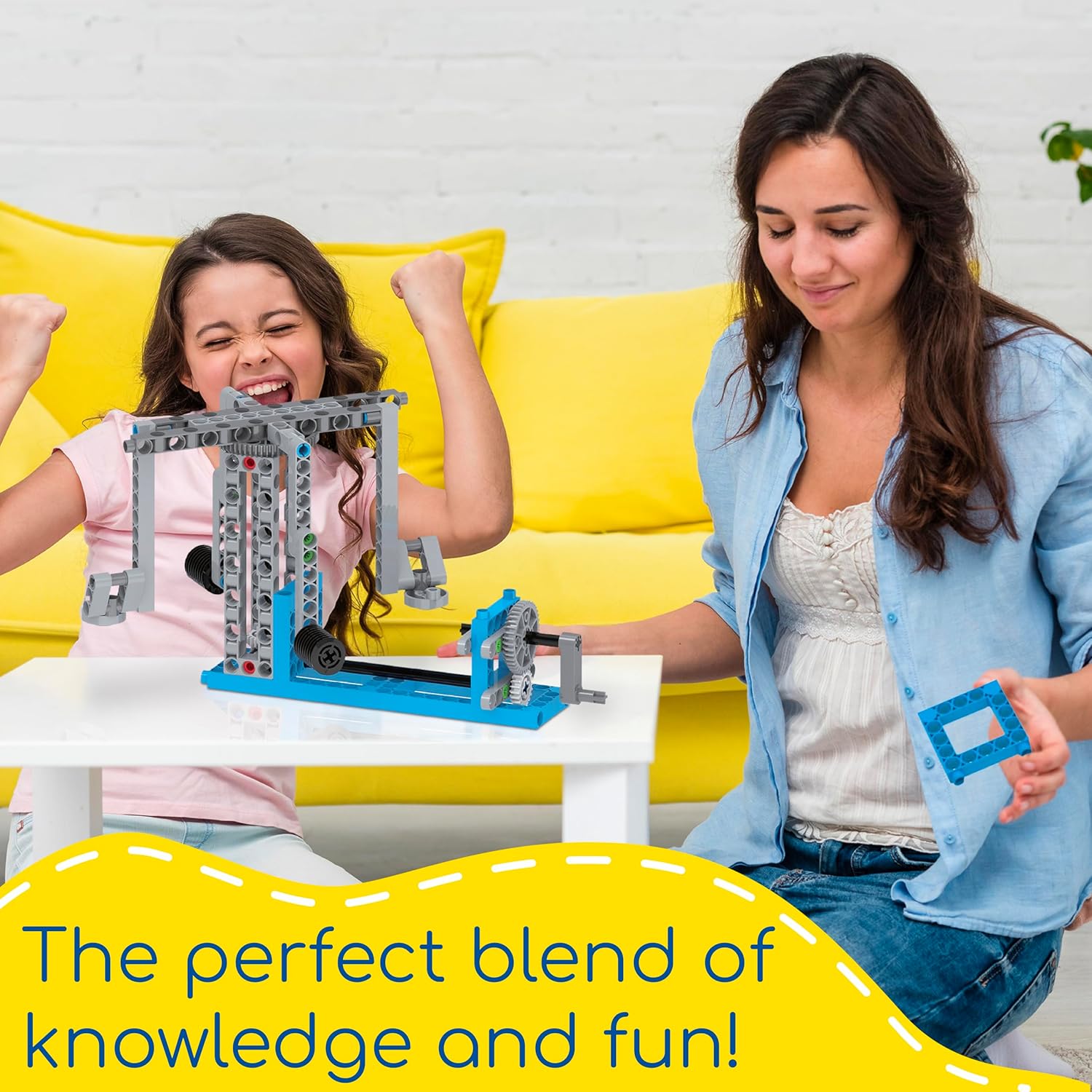 A mum and daughter assembling a model from the Thames & Kosmos Simple Machines kit. Hands-on STEM learning combines knowledge and fun through interactive engineering.